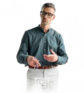 A man in glasses holding a pen for LIG Solutions' lifestyle image
